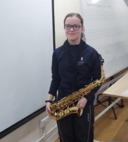 Year 9s Emma B passes her Grade 5 saxophone exam
